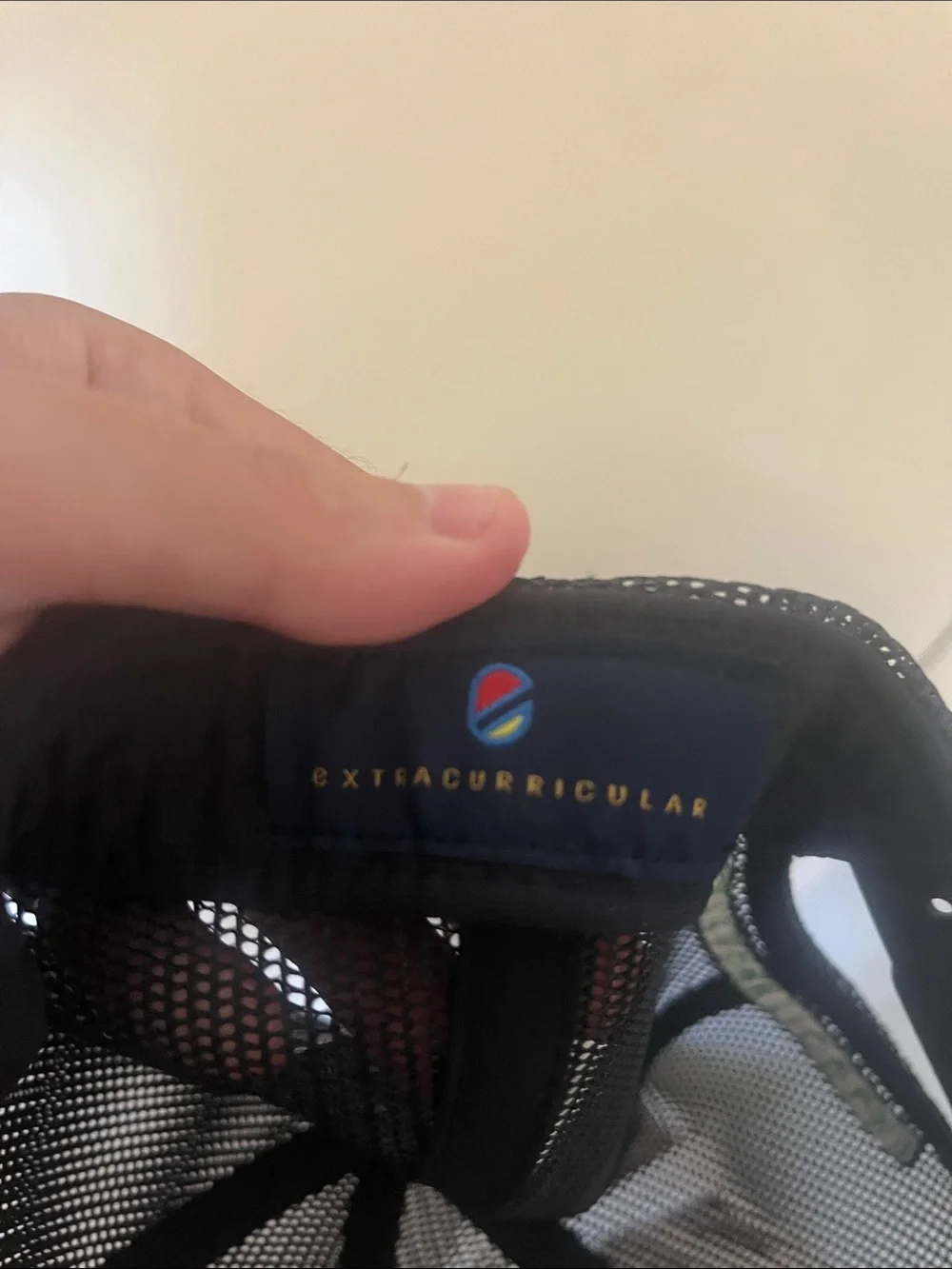 Extracurricular Black Mesh Trucker Cap with White Embroidered Logo